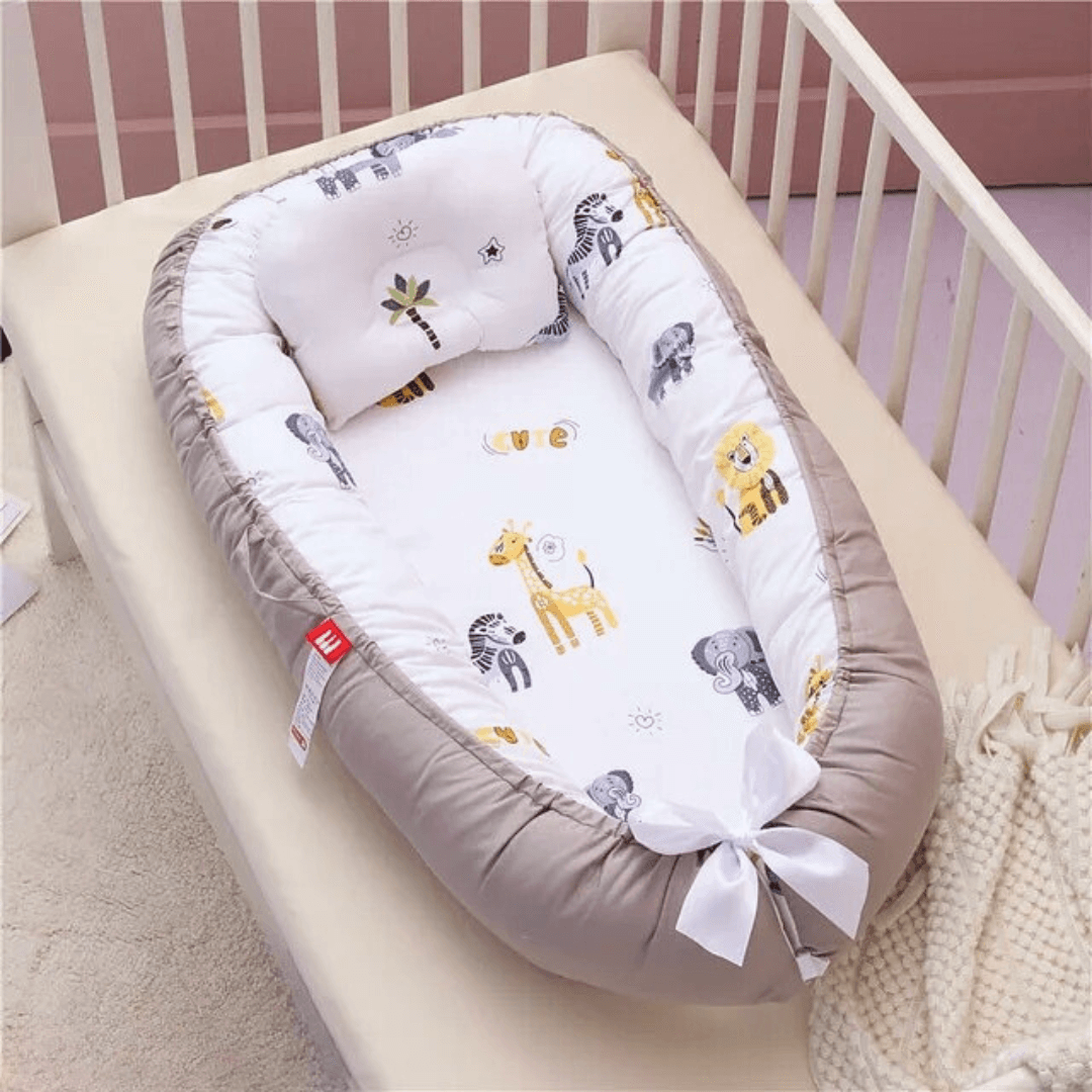 Réducteur de lit pour bébé motifs savane