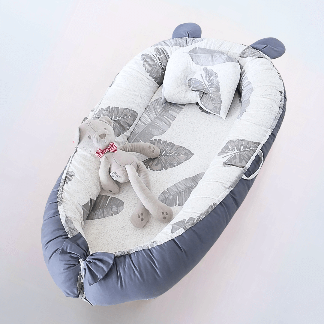 Réducteur de lit pour bébé motifs feuilles