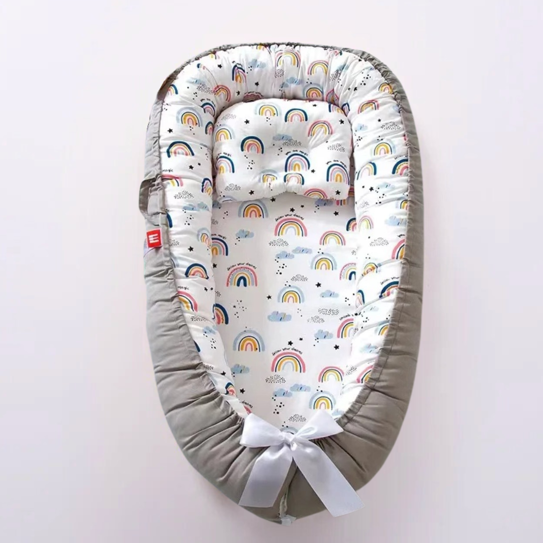 Réducteur de lit pour bébé motifs arc-en-ciel