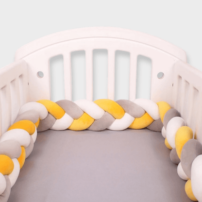 Tour de lit tressé jaune et gris pour bébé