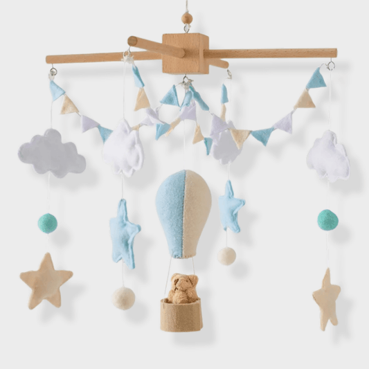 Mobile lit bébé en bois et en laine avec motifs montgolfière
